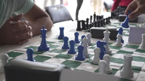 close up in chess tournament of young players