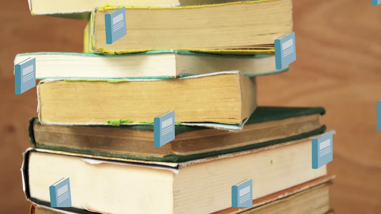 Animation of book icons over stack of books on wooden background