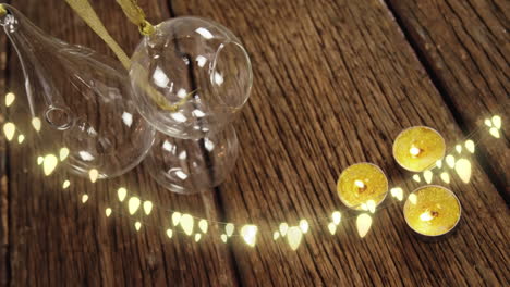 animation of string lights, candles and christmas decorations on wood floor