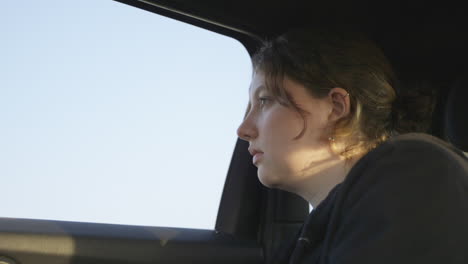 Lady-looking-out-car-window-with-sad-and-depressed-emotional-face