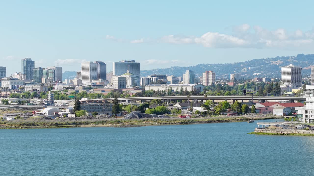 An ascending high angle drone shot of the Embarcadero in Downtown Oakland California.