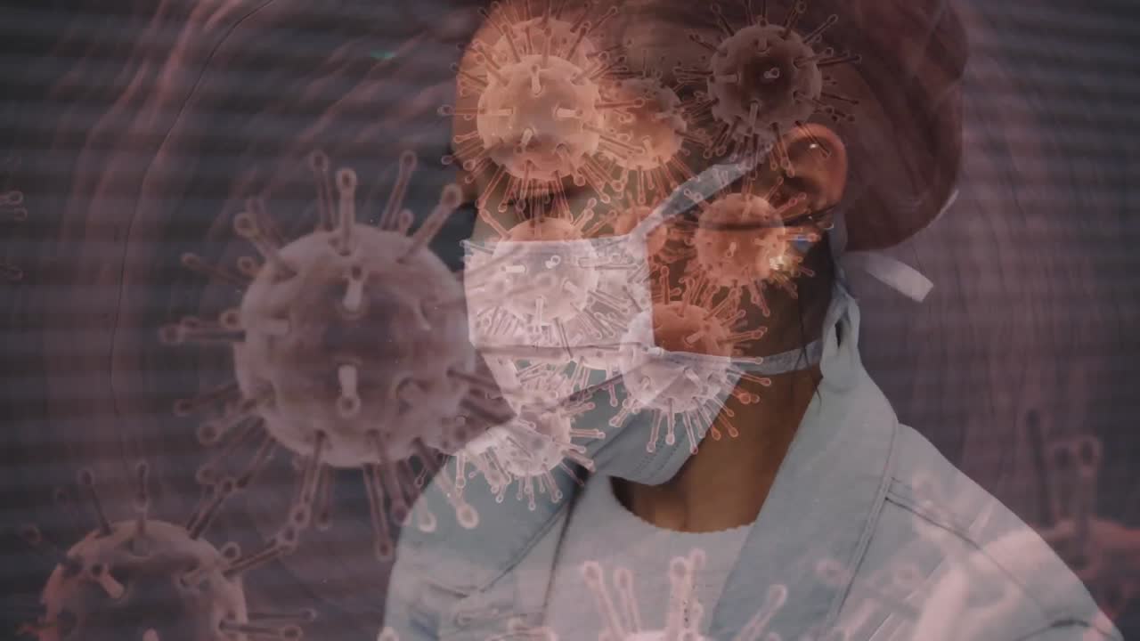 Animation of covid 19 cells moving over woman in face mask