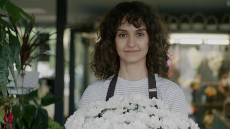 woman florist holding a bouquet of flowers