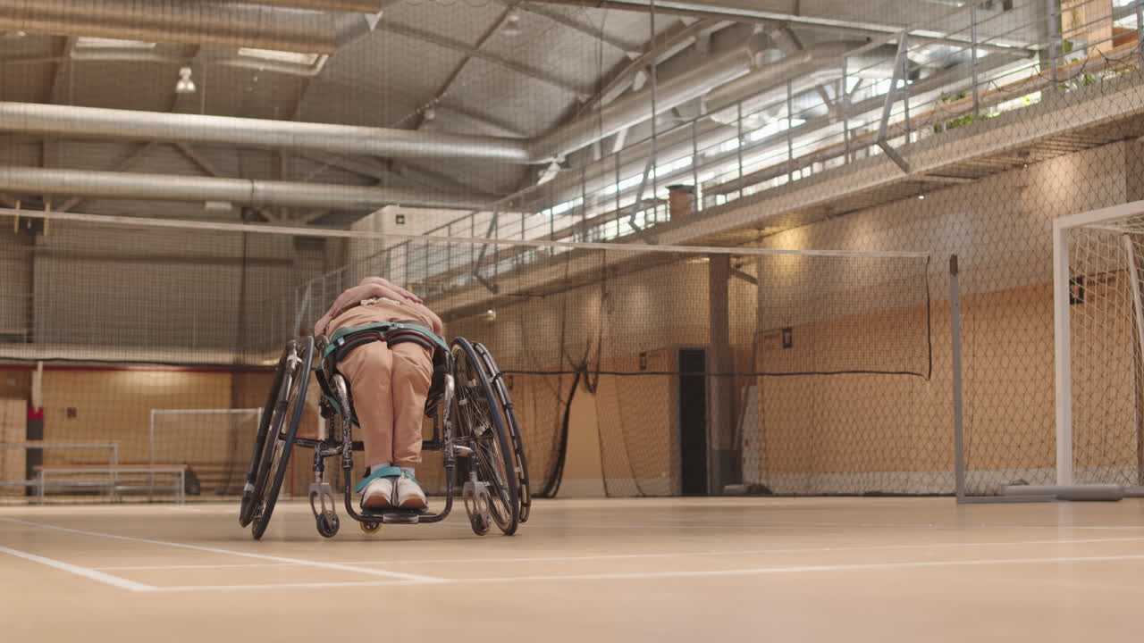 Girl in Wheelchair Warming Up Before Workout