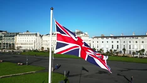 union flag of the united kingdom flying in the naval port of plymouth, uk