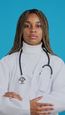 serious female doctor with braided hair and stethoscope