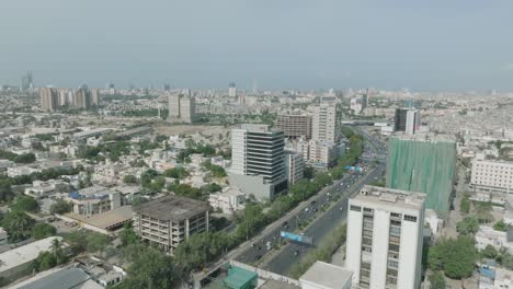 Shahrah-e-Faisal-Road-in-Karachi,-Pakistan-aerial-over-main-road-and-city