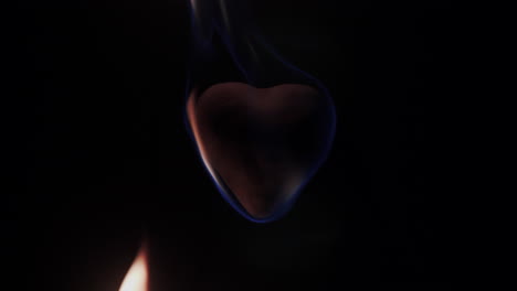 slow motion closeup of a heart in flames