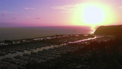 Drone-footage-of-sunset-over-Dana-Point-Harbor,-in-Dana-Point-California