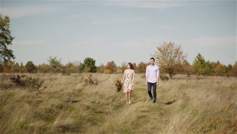 smiling couple together in open field
