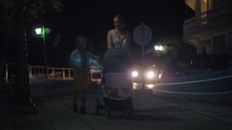 Mother-with-elder-son-and-baby-walking-in-the-evening