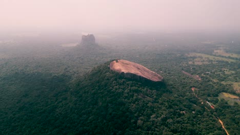 view-of-Pidurangala-rock-and-Lion-Rock-in-a-fog-day---Sigiriya---Sri-Lanka