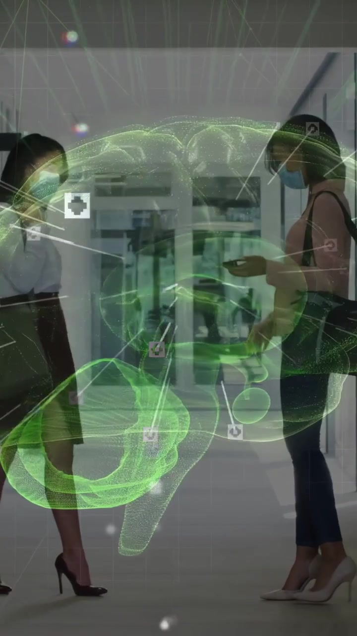 Vertical video: 2 women tapping phones fixing shoe in hall phone tap causing holo brain health data