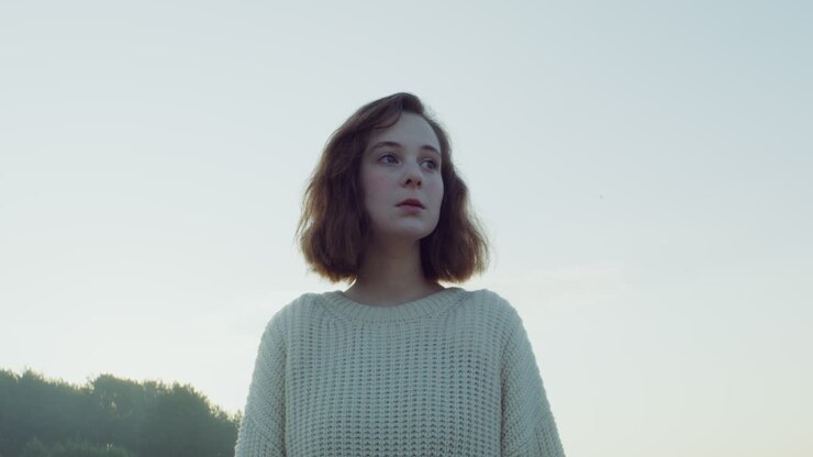 Young Woman in a Field at Dawn