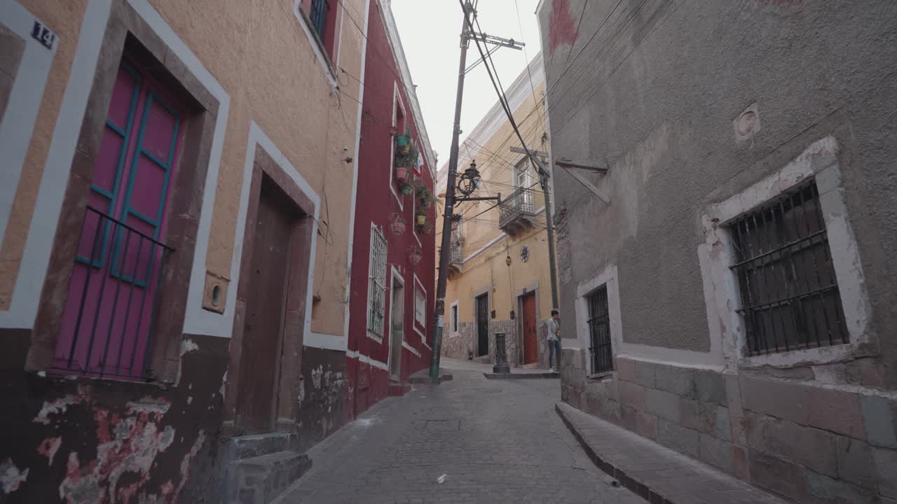 Narrow alleyway with colorful buildings