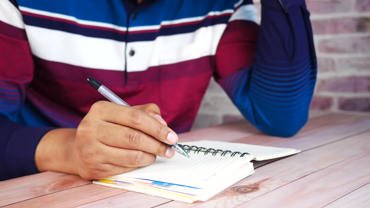 Person writing in a notebook