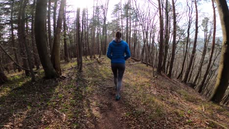 woman jogging on a forest trail