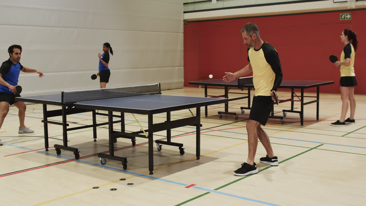 Playing table tennis, group of people enjoying indoor sports activity