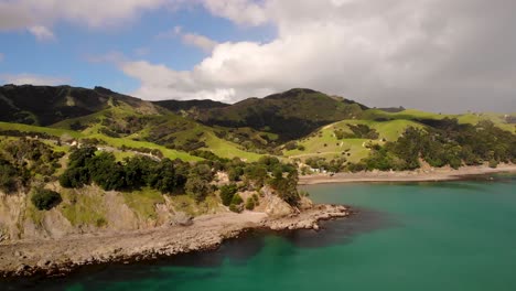 Aerial-landscape-view-of-Coromandel-Peninsula-green-and-cliffy-coastline,-New-Zealand