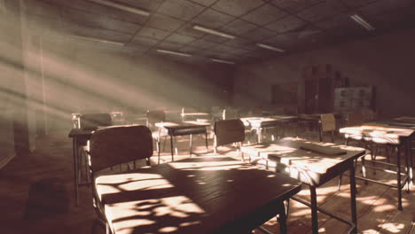 view to classroom with tables and small blackboard and grungy walls