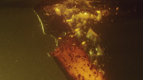 bubbles form around a sharp knife dipped in oil