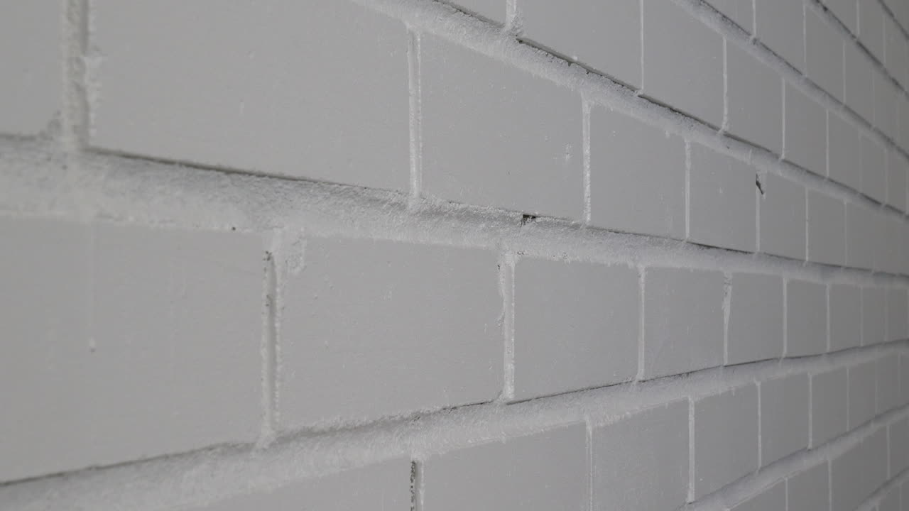 흰색 벽돌 벽 배경입니다. 측면 샷