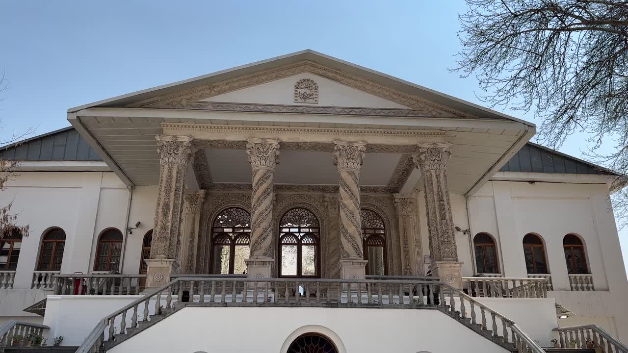Tehran city attraction in Tajrish Square Ferdows Garden traditional architecture mansion old urban landscape. Palace with golden color iconic art museum landmark scenic walking in Middle East summer