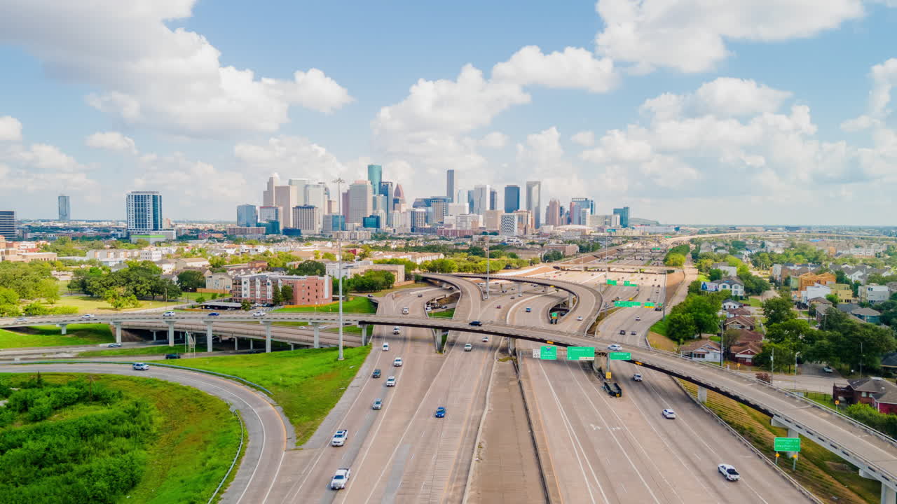 Downtown Houston Drone hyper-lapse on Sunny day. Timelapse traffic on Highway 288 overlooking downtown Houston. Traffic on freeway Texas 288 Timelapse aerial