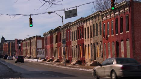 traffic passes in front of a slum in an american city 1