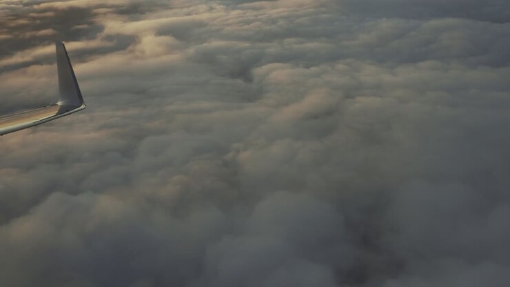 Flying over the clouds on a passenger jet