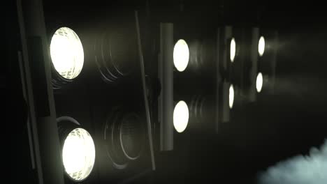 large projectors with flickering light create color music