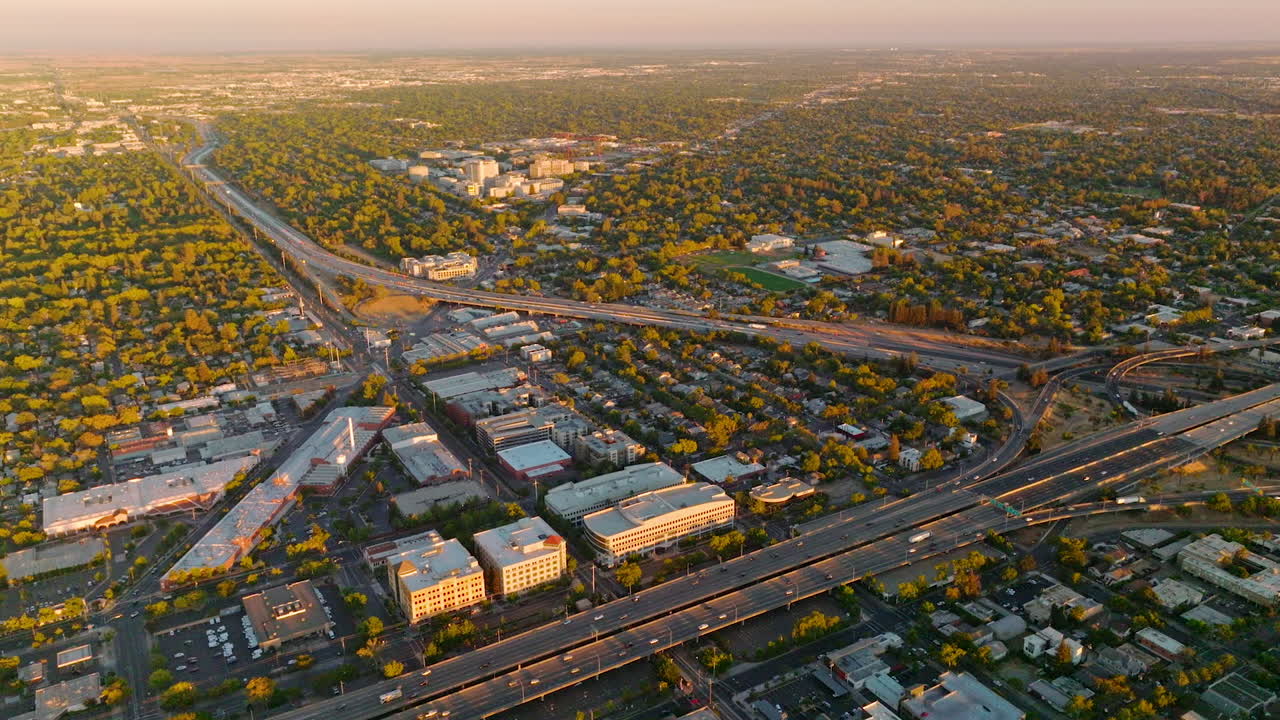 Vast scenery of green beautiful city with wide multi-lane roads. Fine picture of Sacramento, California, USA at sunset.