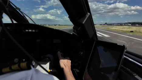 Close-up-immersive-view-of-a-caucasian-pilot-handling-the-flight-controls-in-a-real-time-landing