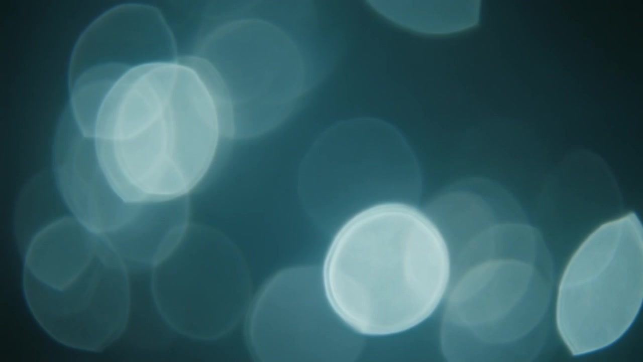 Abstract Background of Soft Glowing Blue Bokeh Circles