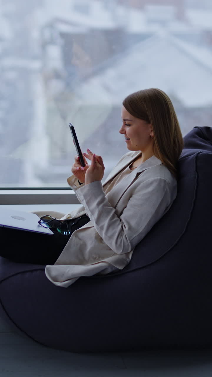 Young lifestyle woman using smartphone. Business manager chatting with phone. Vertical video