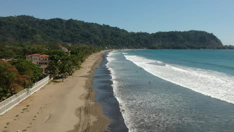 A-flight-over-beautiful-Jaco-Beach,-Costa-Rica