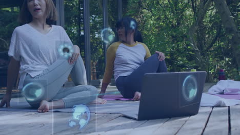 Animation-of-data-processing-over-asian-mother-and-daughter-with-laptop-practicing-yoga