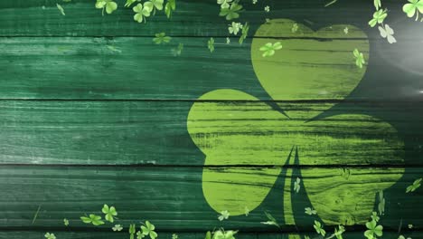 Animation-of-green-clovers-floating-with-clover-leaf-on-background-for-St.-Patricks-day