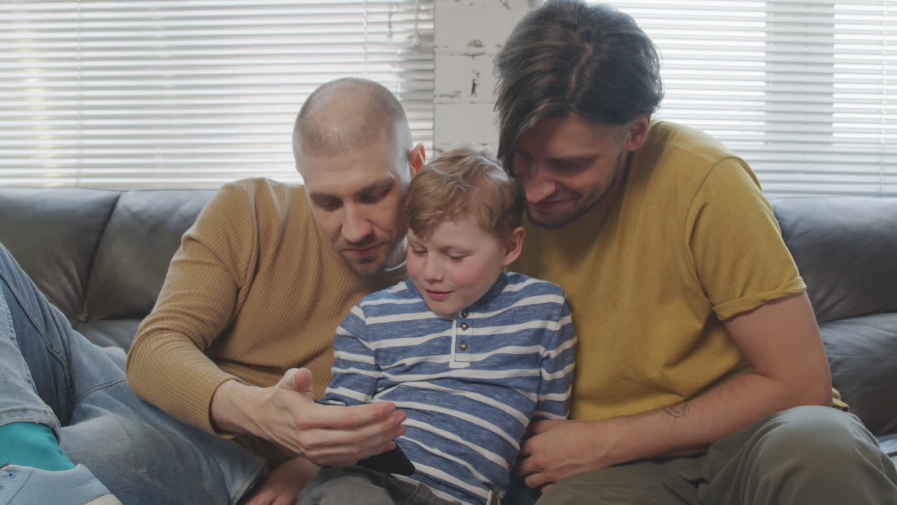 Fathers and Little Son Using Mobile Phone