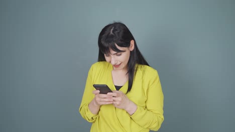 The-woman-looking-at-the-phone-is-happy.