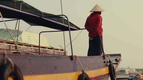 woman on a traditional river boat