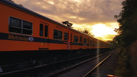 train passing by on a beautiful sunset