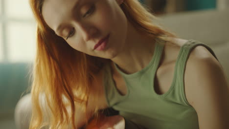 girl playing guitar in room