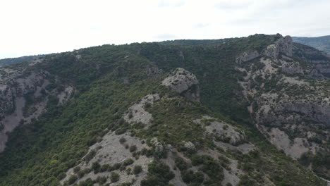 Rocky-mountain-ridges-with-mediterranean-scrubland-garrigue-aerial-drone-view