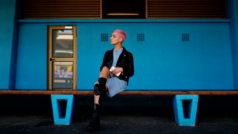 woman waiting for train in railway station 4k