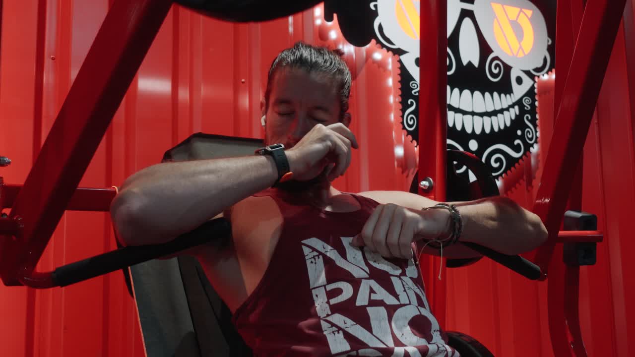 close-up shot of a bodybuilder tired after finishing chest press set