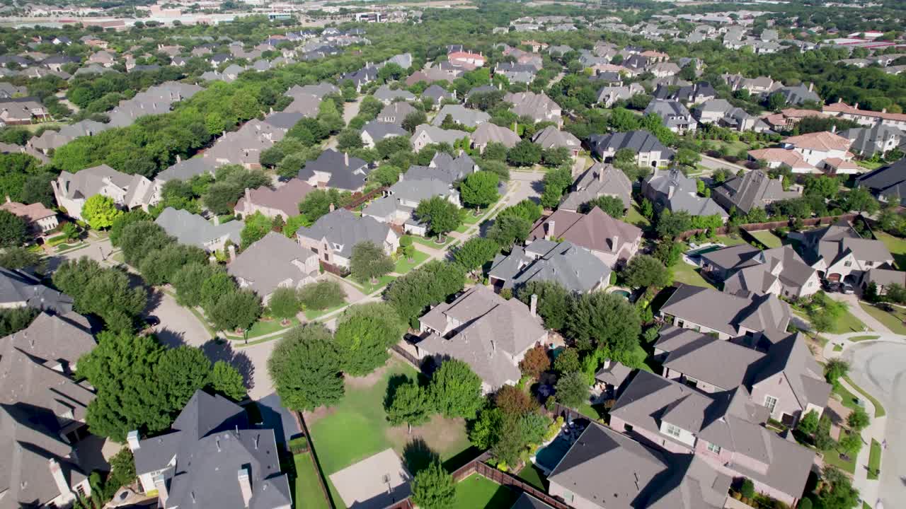 Aerial video of houses in a neighborhood in Frisco Texas