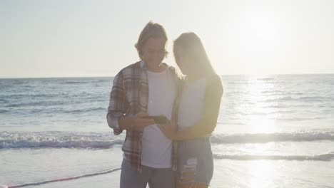 Caucasian-couple-enjoying-their-time-seaside