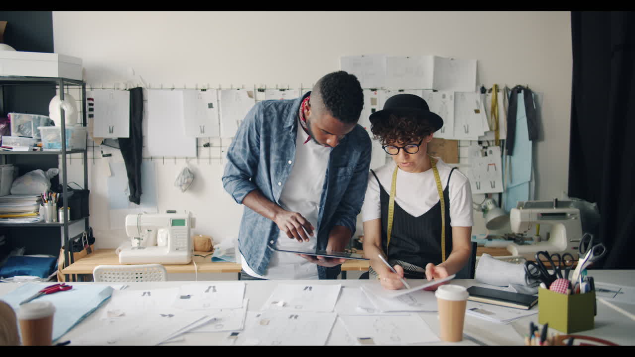 Fashion Designers Collaborating in a Design Studio