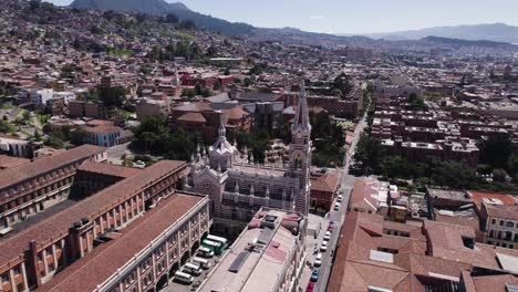 Santuario-Del-Carmen\'s-Intricate-Spire-Over-Bogotá,-Colombia---Aerial